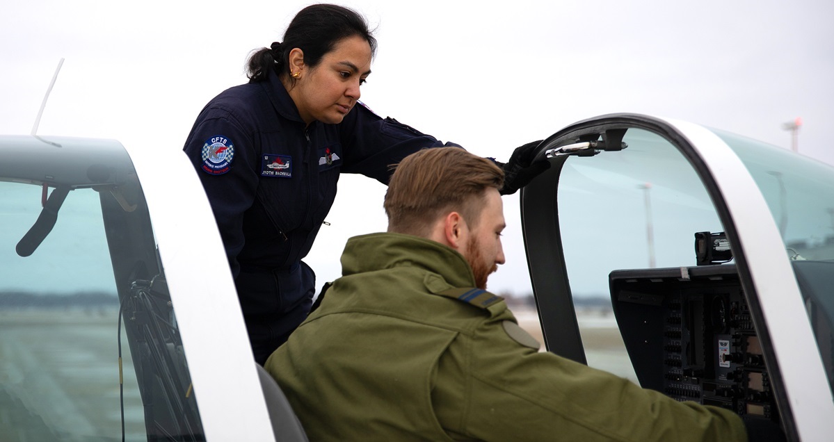 Jyothi Bachwala instructs a Canadian military pilot student at the CFTS Program.