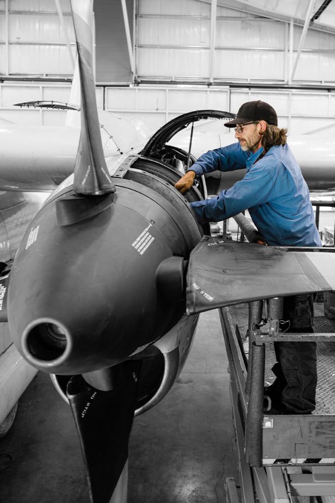 Aircraft Maintenance Engineer inspects a propeller