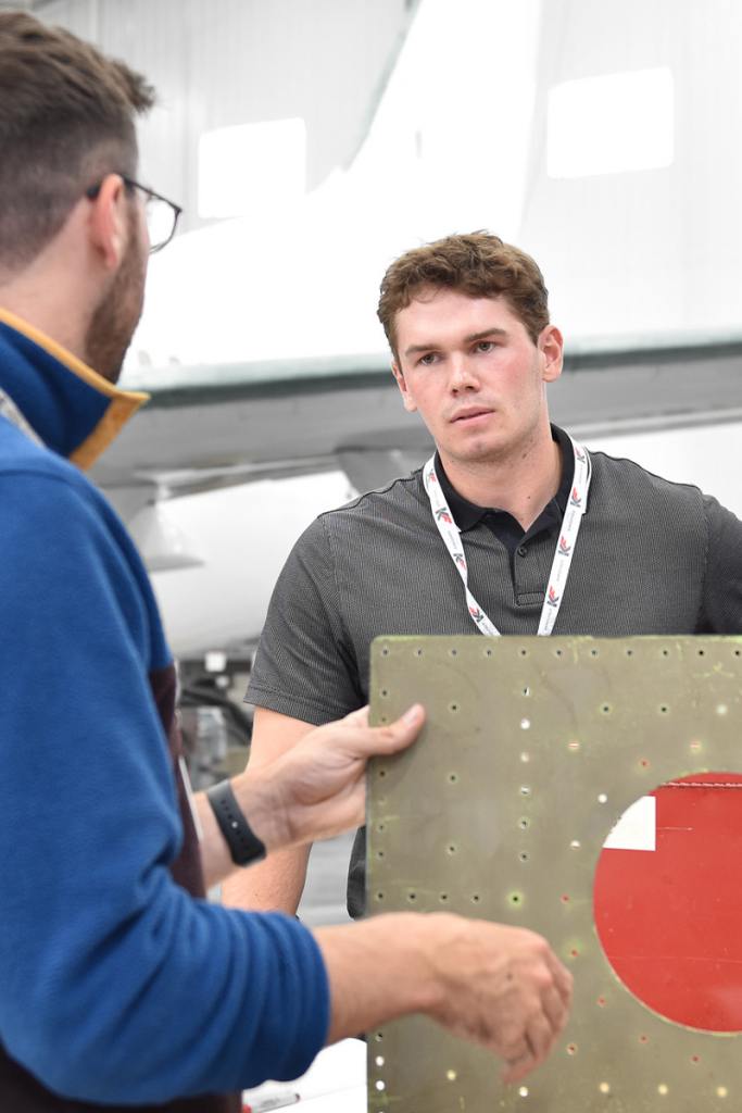Aircraft Maintenance Engineer inspects a propeller
