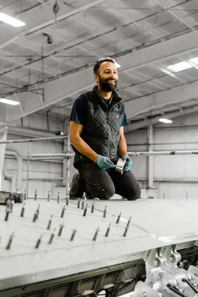 Aircraft Maintenance Engineer inspects a propeller