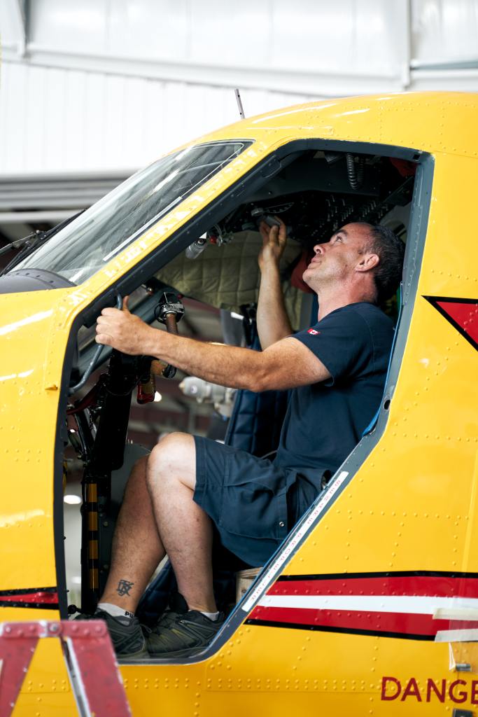 Aircraft Maintenance Engineer inspects a propeller